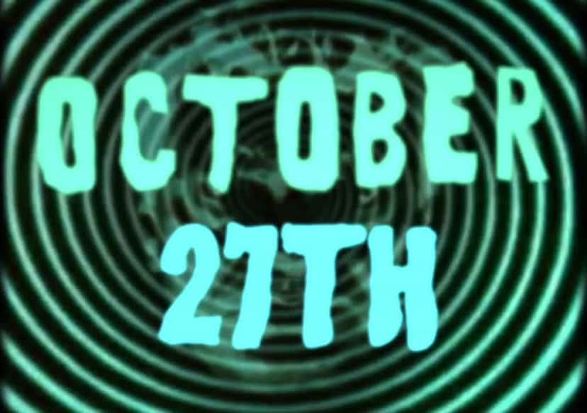Imagen del teaser oficial «Hypnotism»: la leyenda «October 27th» en letras verdes y celestes de estilo terror, sobre un espiral verde
